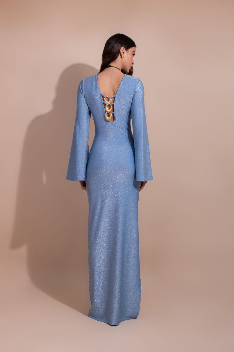 Blue Laura Escobar Baru long dress, a stylish maxi dress with flowing fabric and elegant design, displayed on a hanger.