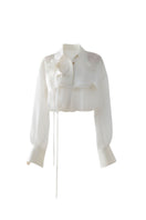White sheer organza shirt by DOC BAN, showcasing lightweight, translucent fabric and classic button-down design.