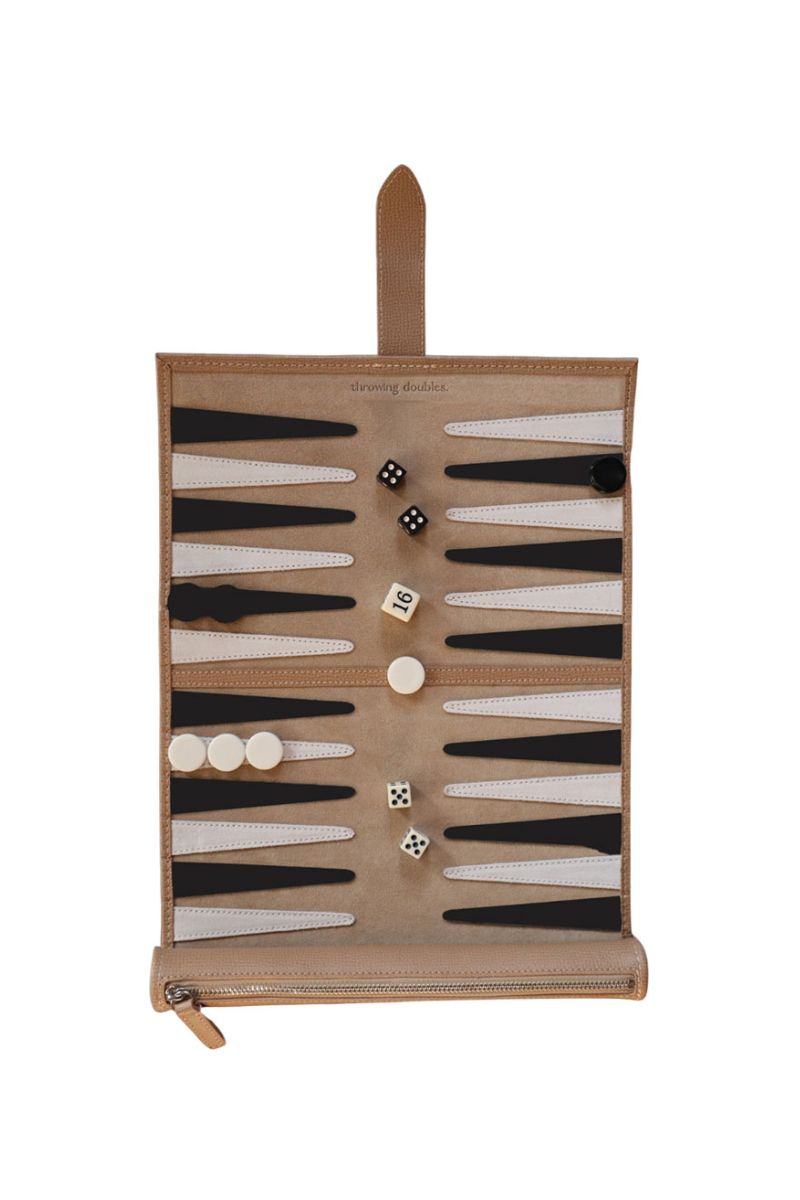 Travel Backgammon board in Manhattan style by Throwing Doubles, featuring a colorful game board with checkers and dice.