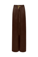 LEDIEL NERU brown pants shown on a model, featuring a relaxed fit and casual style with side pockets.