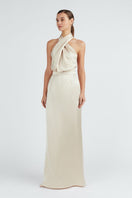 Undress ALIUR champagne halter neck evening dress, a stylish maxi dress with elegant design and flowing fabric.