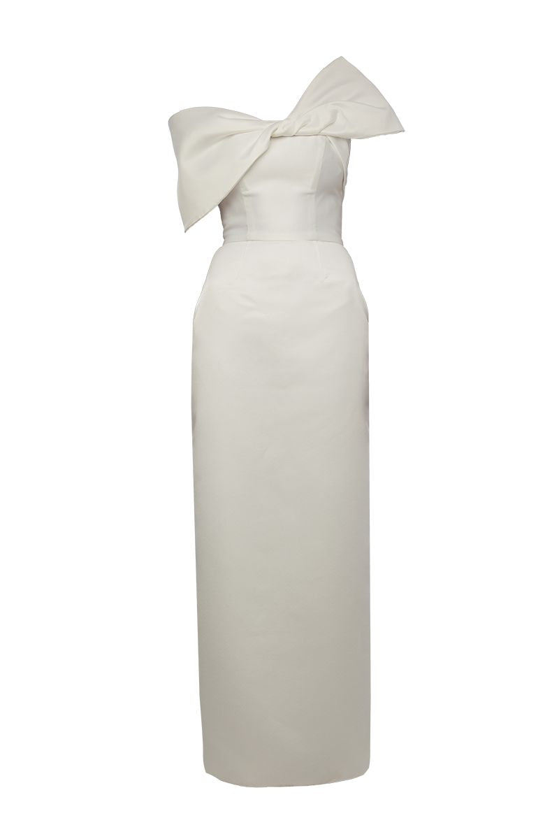 Elegant BAÉ GIGI White Maxi Dress with shoulder bow, flowing fabric and stylish design perfect for summer occasions.