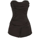 Nana Jacqueline Athena black jumpsuit with wide-leg design and fitted bodice, showcased on a model.
