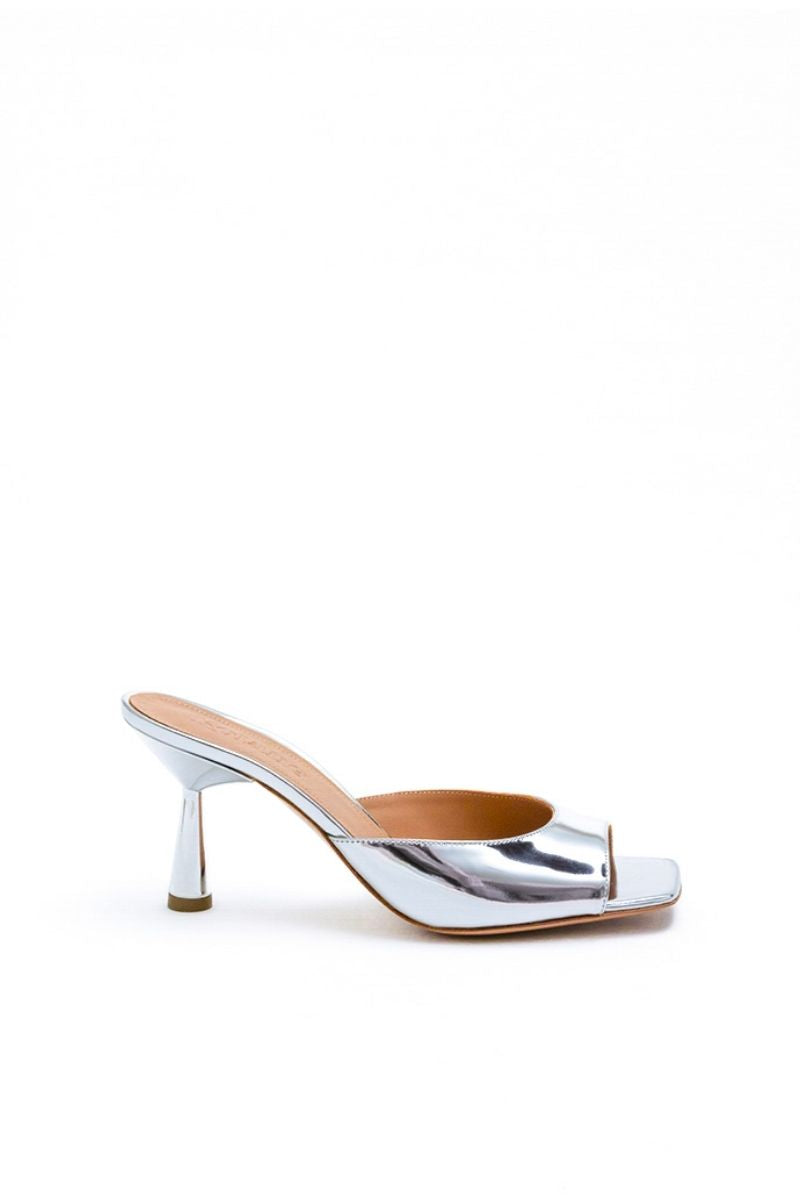 Kolane Greta mule sandals in silver with open toe and ankle strap, stylish slip-on footwear for women.
