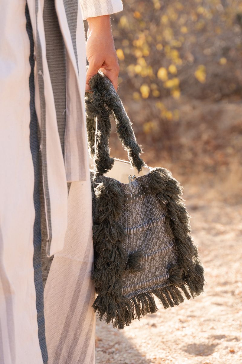 Bani medium olive top handle bag with structured design and dual handles, perfect for everyday use.