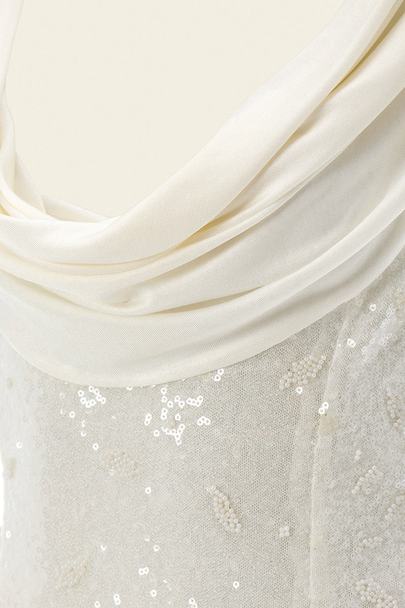 White Scylla dress by IKINITA, elegant gown with flowing fabric and stylish design, shown on a model.