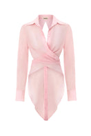 Pink Ulysse shirt by IKINITA, featuring a tailored fit and soft fabric, displayed hanging on a wooden hanger.