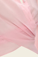 Pink Ulyssé shirt by IKINITA featuring a relaxed fit, long sleeves, and a classic collar, displayed on a hanger.