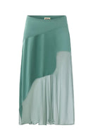 Emerald green Nausica midi skirt by IKINITA displayed with flowing fabric and elegant design.