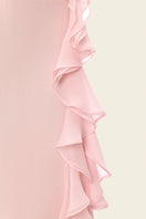 Pink Lotus Eater maxi skirt by IKINITA displayed on a hanger with soft fabric texture and flowing design.