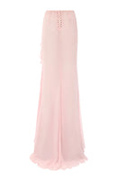 Pink IKINITA Lotus Eater maxi skirt with flowing fabric and waistband, styled for a chic, casual look.