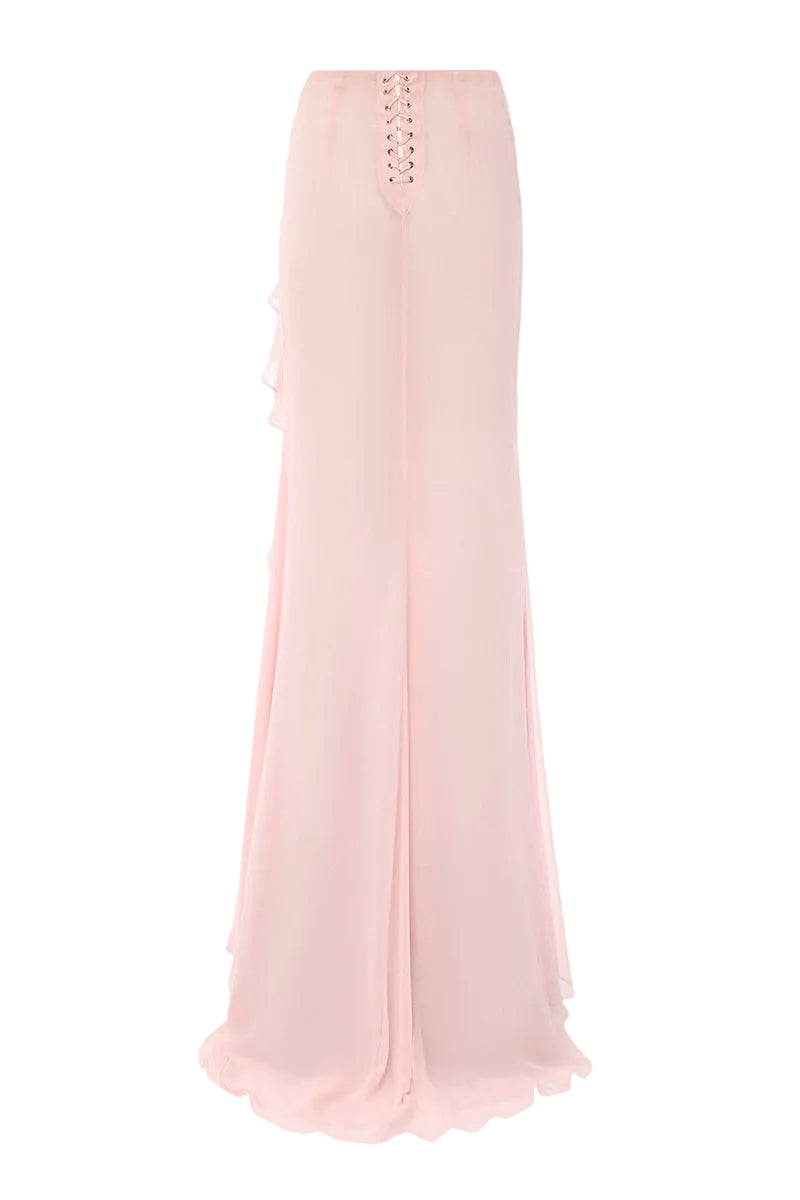 Pink IKINITA Lotus Eater maxi skirt with flowing fabric and waistband, styled for a chic, casual look.