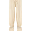 Cream SCYLLA pants by IKINITA, featuring a stylish design with a comfortable fit, displayed on a mannequin.