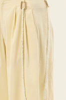 IKINITA ULYSSE yellow pants in butter yellow fabric, featuring a stylish, relaxed fit and modern design.