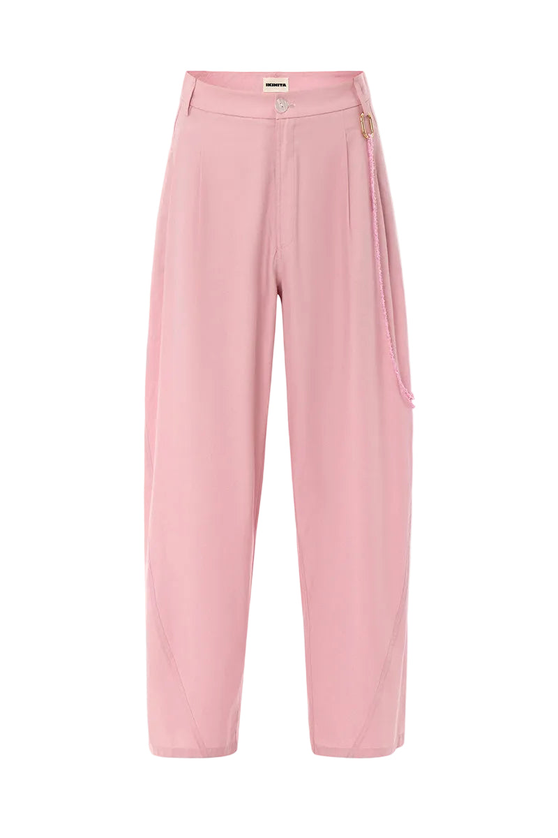 Pink Ulysse pants by IKINITA displayed on a model, showcasing a stylish and comfortable pair of casual pants.