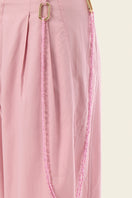 Pink Ulysse pants by IKINITA, featuring a comfortable fit and stylish design, displayed on a model.