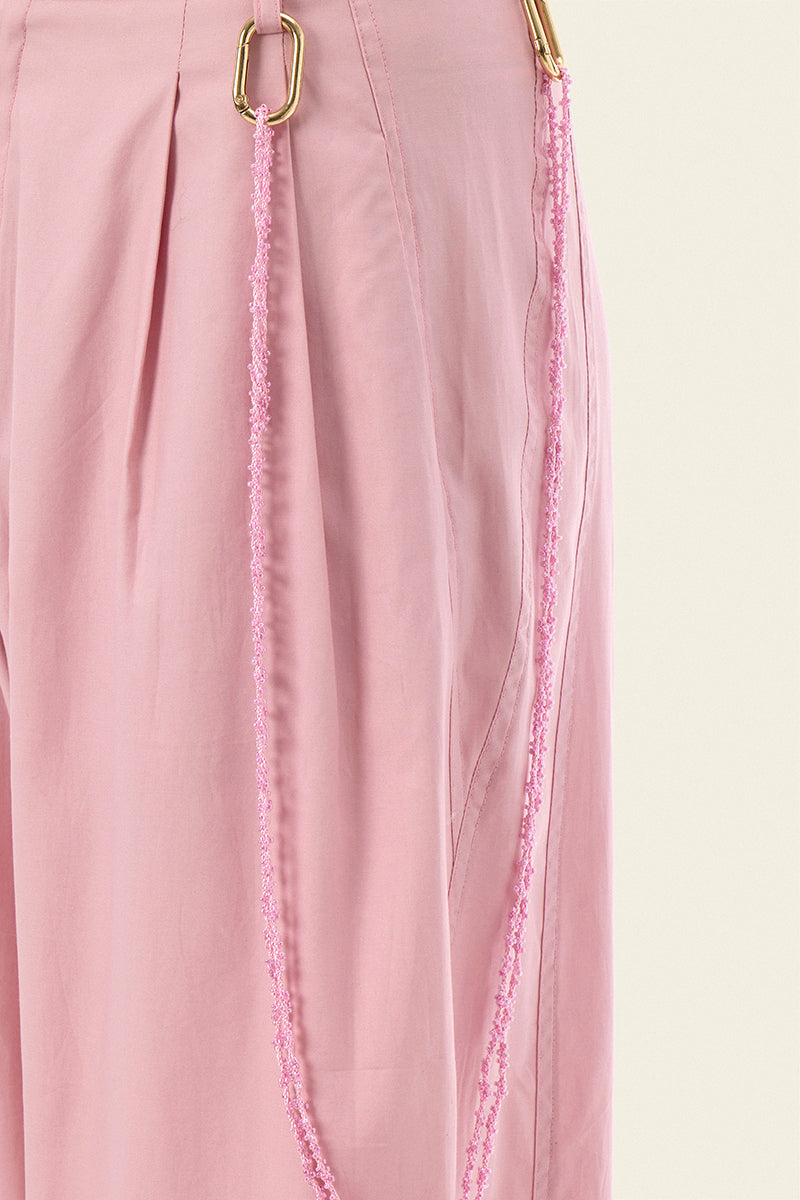 Pink Ulysse pants by IKINITA, featuring a comfortable fit and stylish design, displayed on a model.