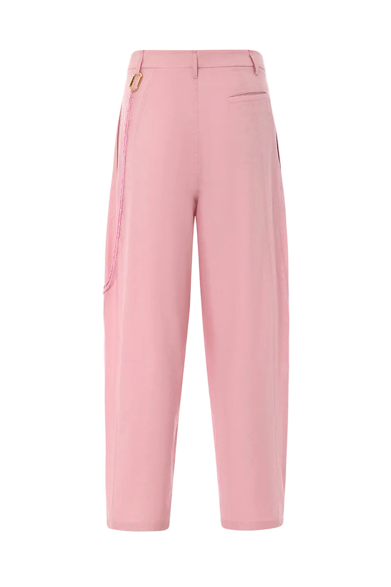 Pink Ulysse pants by IKINITA, shown in a stylish fit with soft fabric and a comfortable waistband.