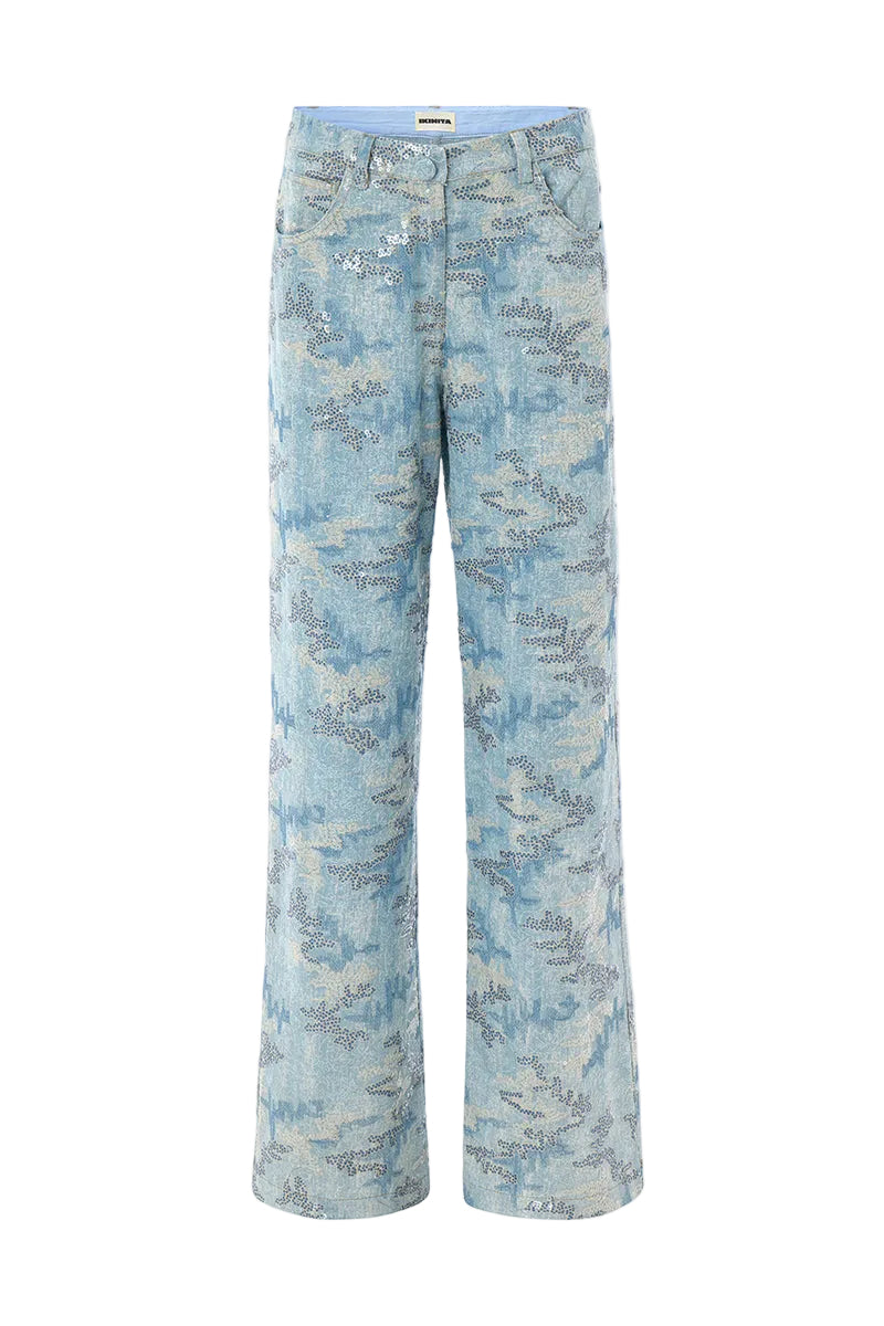 Blue IRIS pants by IKINITA featuring a relaxed fit and stylish design, shown laid flat on a neutral background.