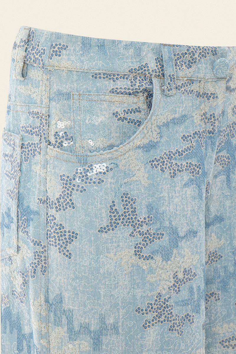 Blue IRIS pants by IKINITA, featuring a comfortable fit and stylish design, shown on a model.