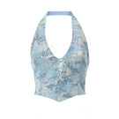 Blue IRIS top by IKINITA, featuring a stylish design, shown on a model with a relaxed fit and modern look.