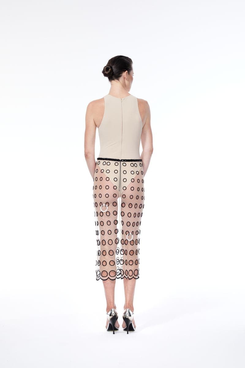 Nué nude piercing midi skirt featuring a sleek, fitted design with subtle slit details, perfect for a modern, stylish look.