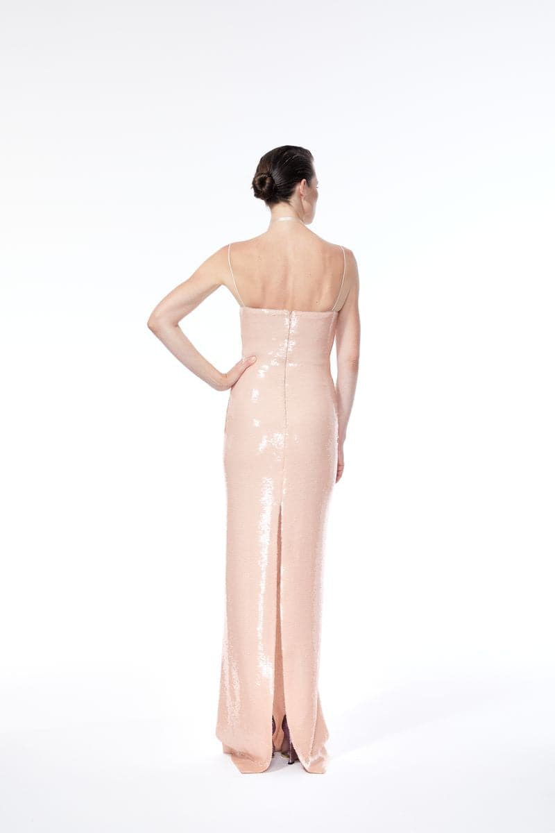 Nué BARE glossy sequin gown showcasing a shimmering, elegant design with a fitted silhouette and intricate sequin detailing.