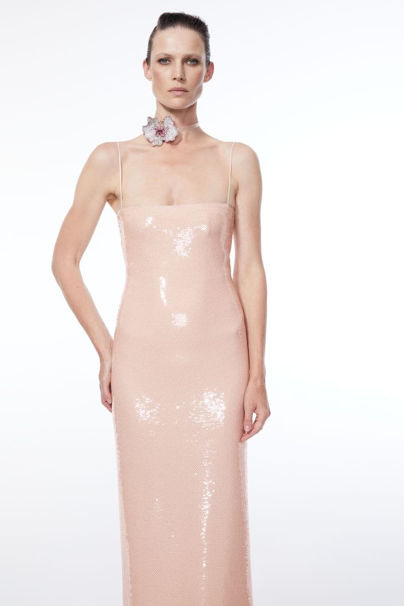 Nué Bare Glossy Sequin Gown featuring shimmering sequins and elegant design, perfect for formal occasions.