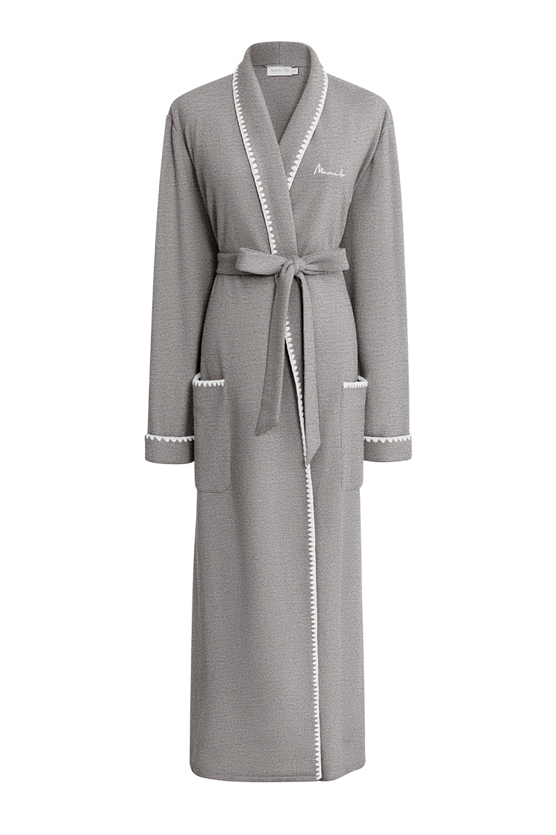 Gray SHELL WOMEN'S WOOL-SILK KNIT ROBE by MANITO, shown hanging on a wooden hook with a cozy, textured knit fabric.