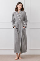 Gray Shell women's wool-silk knit robe by MANITO, soft and cozy, shown hanging with a relaxed fit and textured knit fabric.