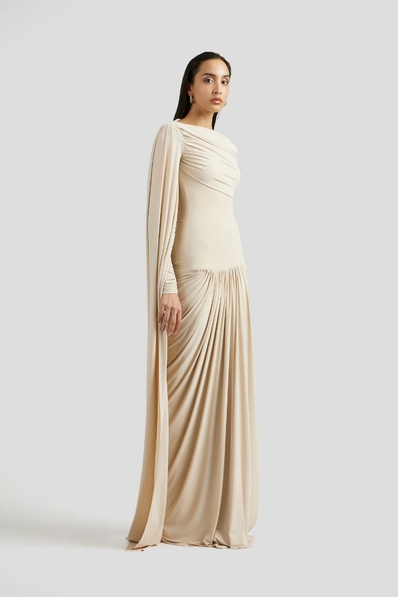 Deme By Gabriella Amara Maxi Dress in ivory, elegant long dress with flowing fabric and sleeveless design, perfect for formal occasions.