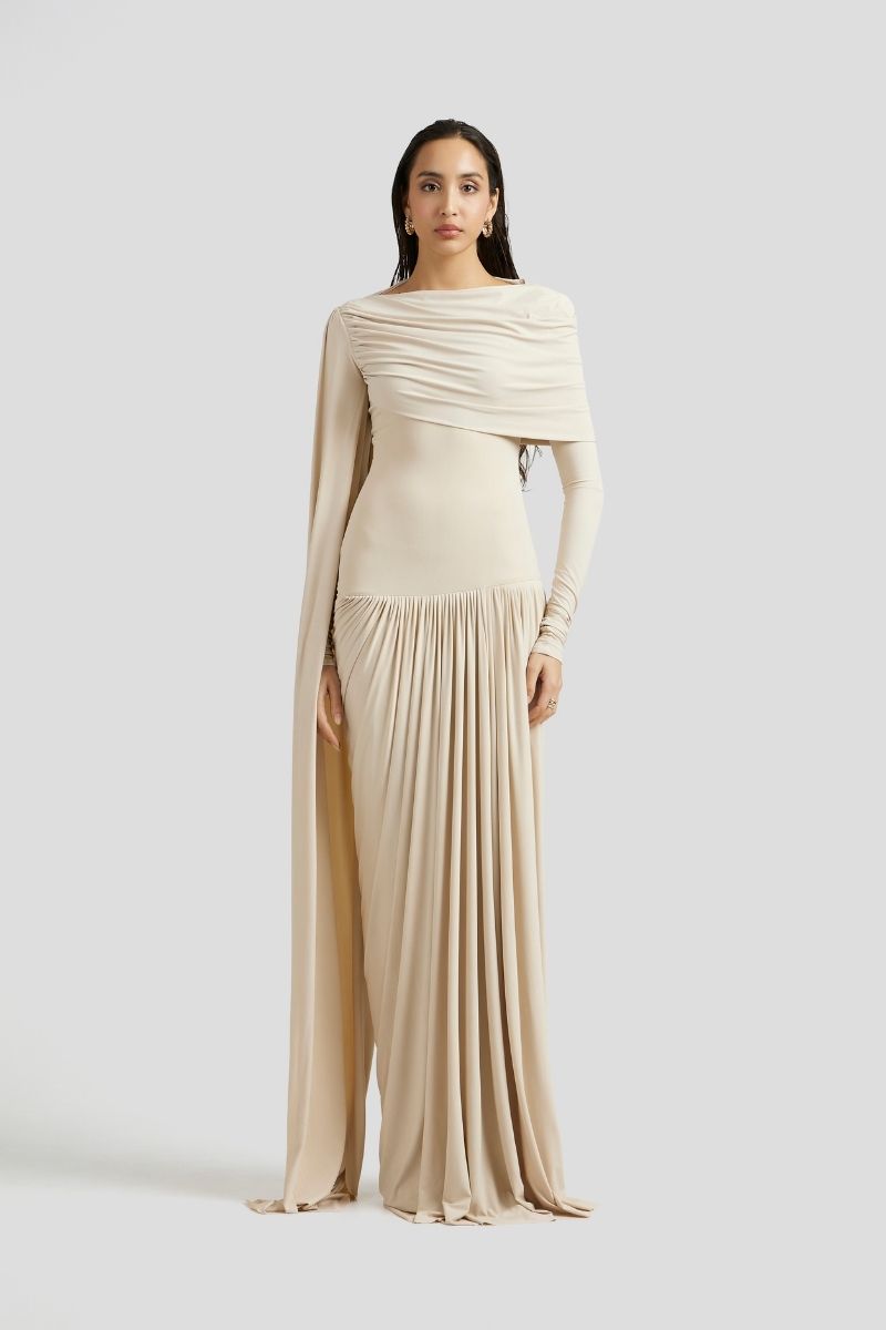 Deme By Gabriella Amara Maxi Dress in ivory, flowing fabric with elegant drape, sleeveless design, and V-neck neckline.
