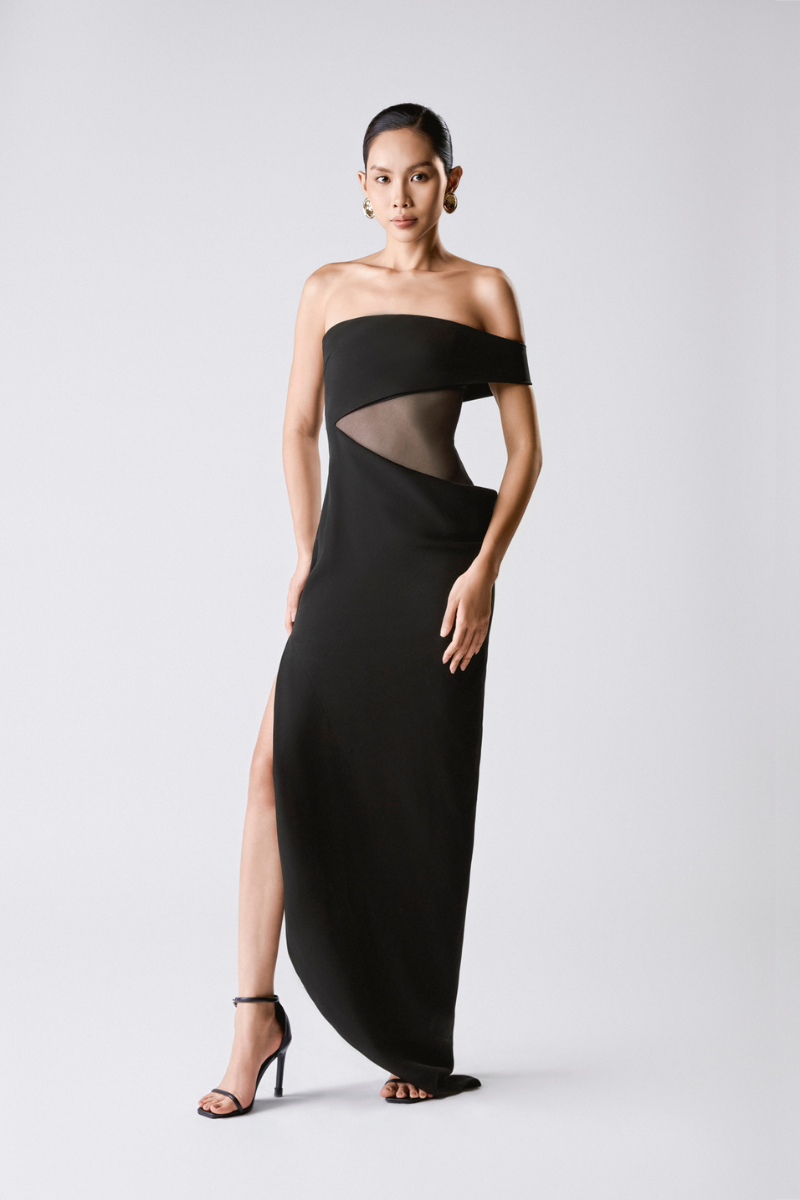 Black NIGHT BLOOM MAXI DRESS by TONYY featuring flowing fabric and a stylish, elegant design for formal occasions.
