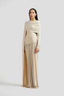 Deme By Gabriella Amara maxi dress in ivory, flowing fabric with elegant design and sleeveless style, displayed on a hanger.