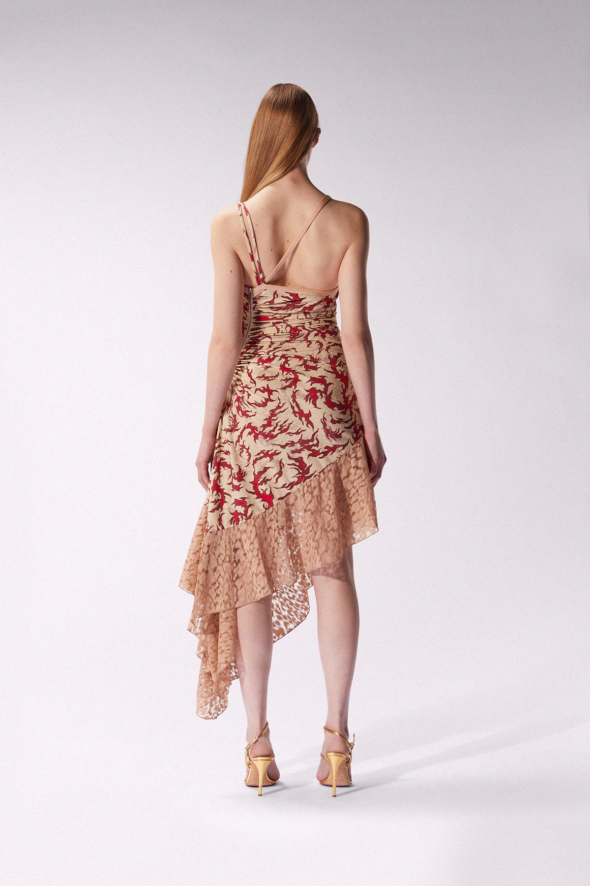 Cream midi dress by Maccapani featuring a flowing silhouette and elegant design, perfect for stylish occasions.