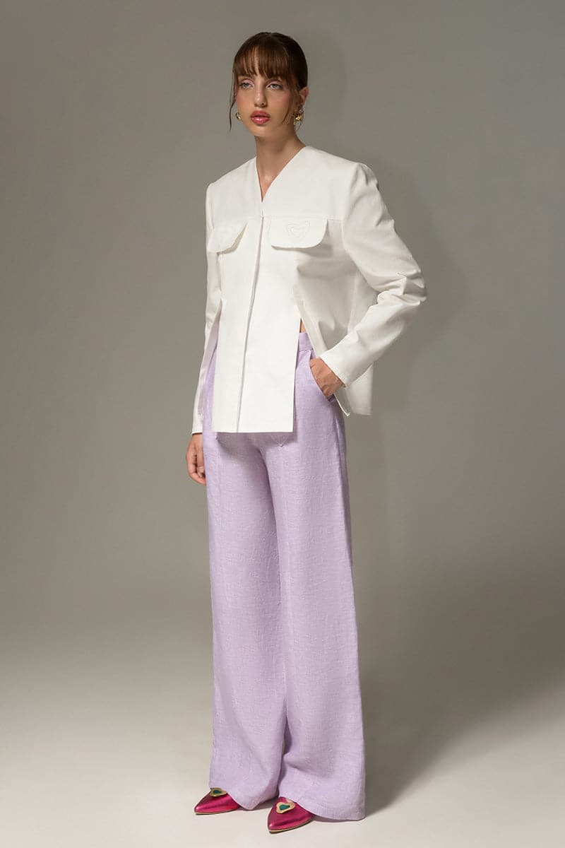 Liya White Sweetheart Blazer shown on a hanger, tailored fit, with notched lapels and long sleeves, stylish and versatile for formal wear.