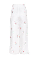 Estefania ivory tulip pants with a relaxed fit and wide-leg design, shown on a model against a neutral background.