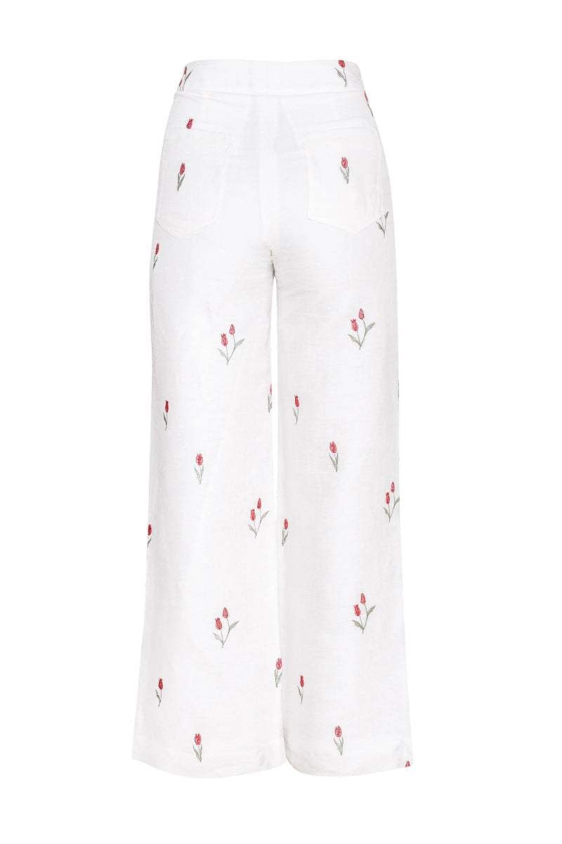 Estefania ivory tulip pants with a relaxed fit and wide-leg design, shown on a model against a neutral background.