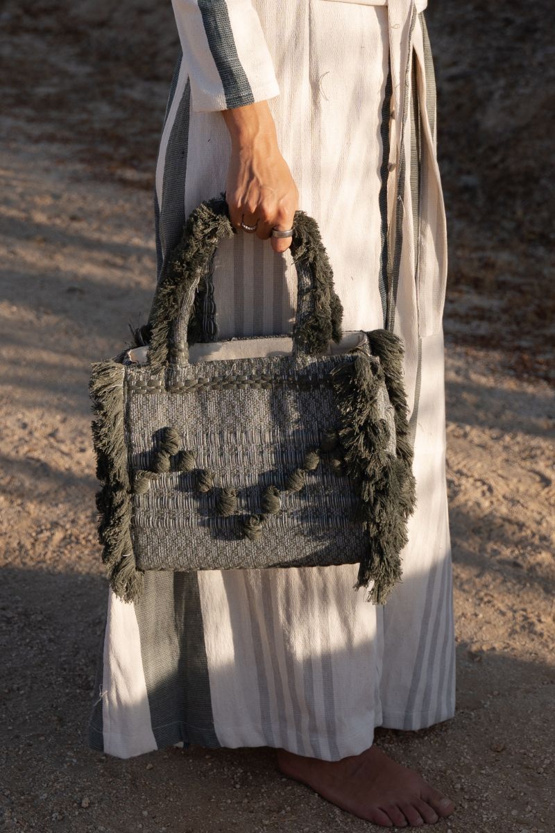 Bani medium Poka olive top handle bag with a structured design and top handle, perfect for stylish everyday use.