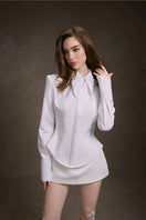 White cupped collar shirt by Keira Tong, featuring a classic design with a rounded collar and button-front detail.