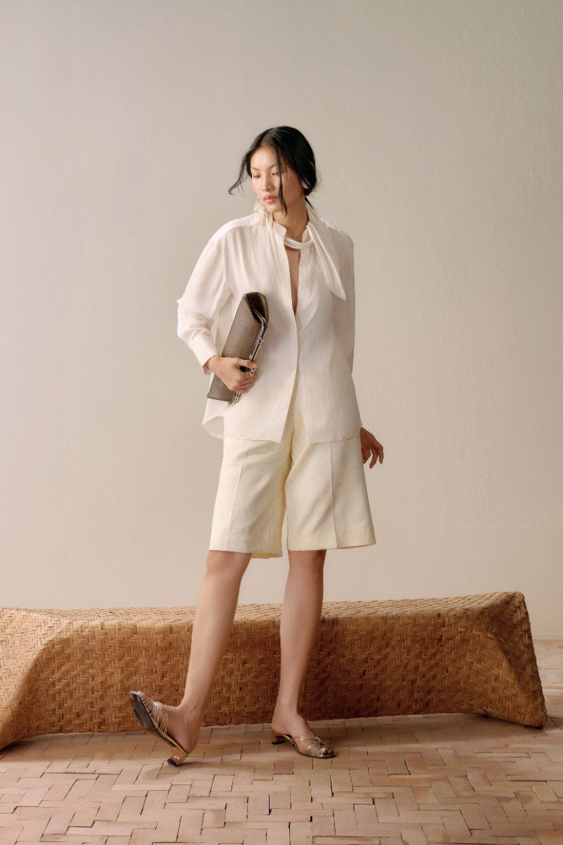 Lecia satin twilly shirt in ivory, featuring smooth fabric and elegant design, displayed on a hanger.