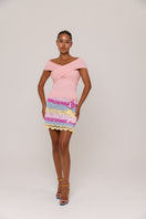 Handmade mini crochet skirt with vibrant bird of paradise pattern by Andreeva, showcasing intricate needlework and colorful tropical design