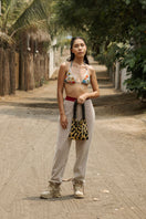 Black and gold leopard print Sac de Soul Clash of Prints shoulder bag with adjustable strap and gold-tone hardware.