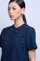 Aidan & Ice Solace white earrings showcasing elegant drop design with smooth, polished finish.