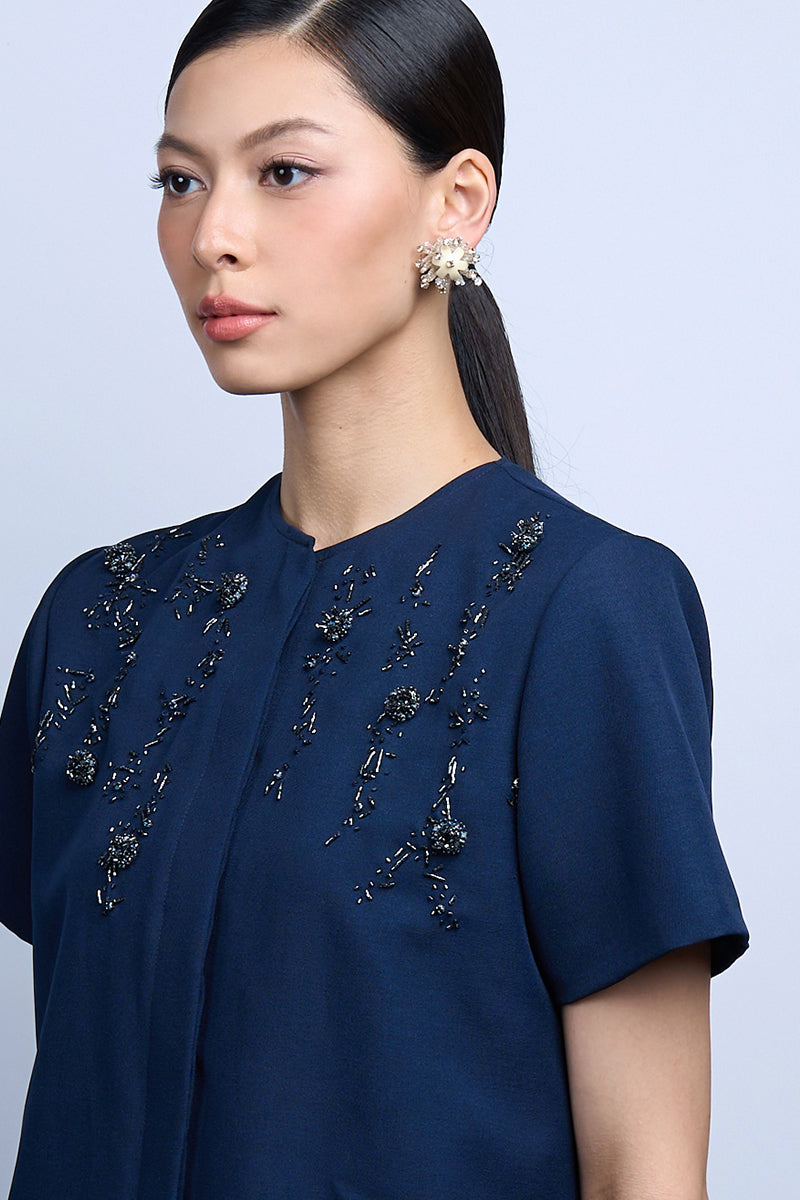 Aidan & Ice Solace white earrings showcasing elegant drop design with smooth, polished finish.
