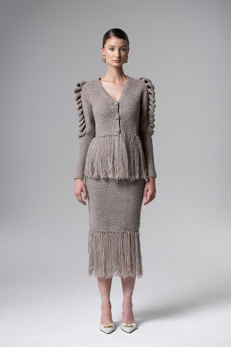 Gray Liya midi skirt with fringe detailing, showcasing the flowing fabric and stylish design.