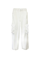 White Kris Marán silky cargo pants with a relaxed fit and multiple pockets, showcased on a model.