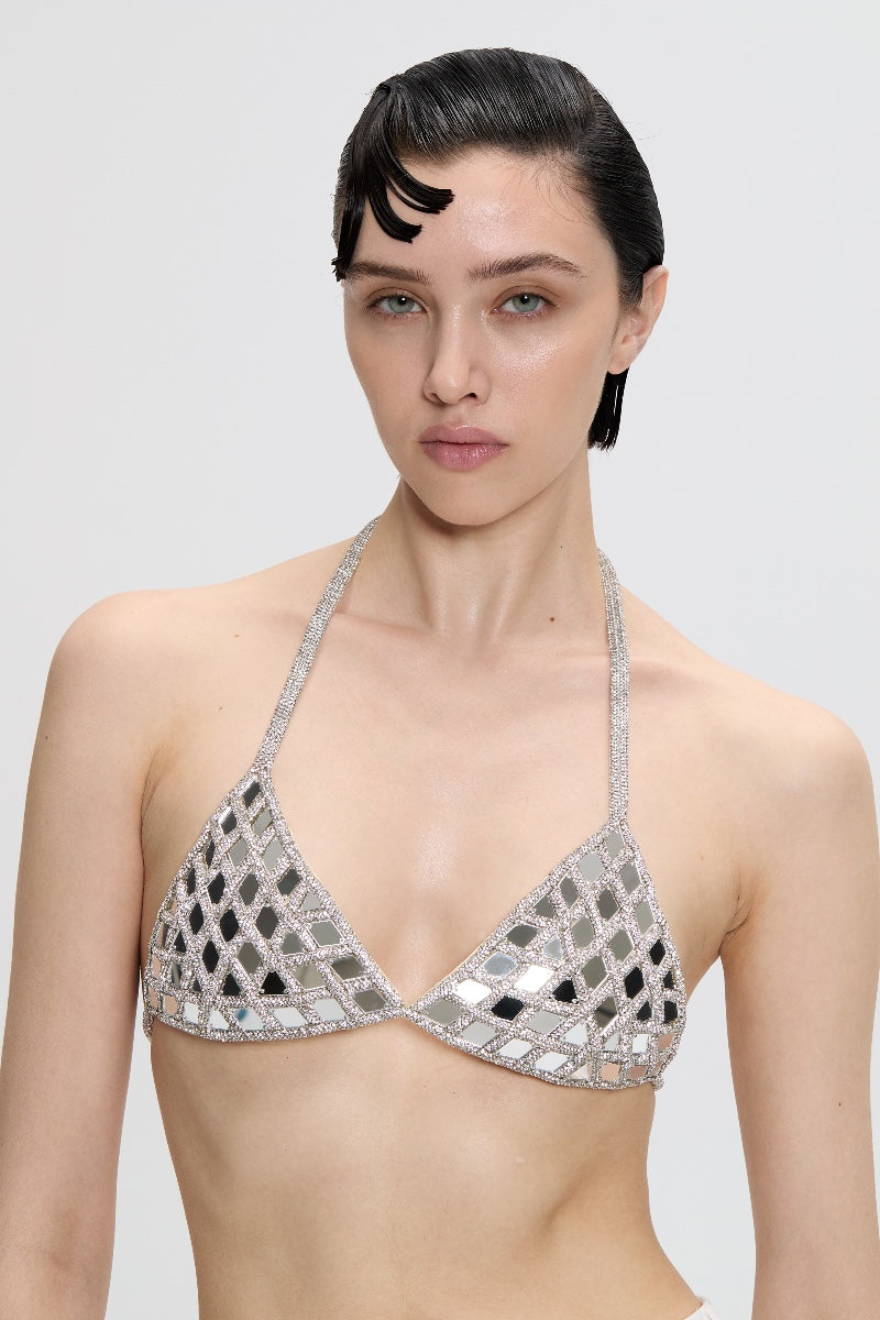 Nué mirror triangle bra top featuring a sleek, modern design with adjustable straps and mirror accents.
