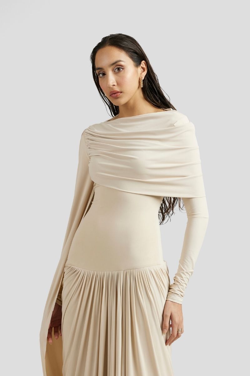 Deme By Gabriella Amara Maxi Dress in ivory, flowing sleeveless gown with a fitted waist and elegant floor-length design.