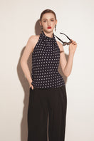 Black Valenciani wide leg trousers with relaxed fit and high waist, shown on a model against a neutral background.